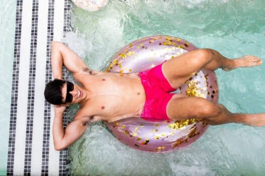 Man lounging on pool floatie